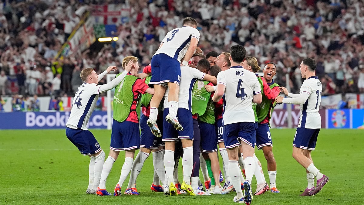 England players celebrate at the end of a semifinal match between the Netherlands and England at the Euro 2024 soccer tournament in Dortmund, Germany, Wednesday, July 10, 2024. England won 2-1. -  (AP Photo/Martin Meissner)